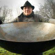 Big Pan Man: Mark Renn with one of his giant woks hired by TV celebrity chef Heston Blumenthal. Picture: Phil Loach.