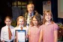 Mayor of Kidderminster, Cllr John Aston, with some of the junior Neighbourhood Watch Programme partcipants from Offmore Primary School receiving their certificates