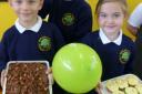 Selling cakes: Year two pupils from left, Lucas Dusconi, Joseph Butler and Florence Ridley, aged six.
