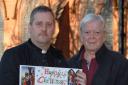 'Very annoyed': Reverend Derek Arnold, left, and Peter Nailer with St John the Baptist Church's communal Christmas card.