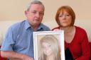 Heartbroken: Eric and Lynn Harvey with a picture of their daughter Vickie.