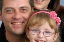 'Happy little girl': Chanelle Robertson, four, with parents Stephen and Jodie Robertson.