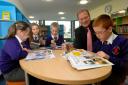 NEW LOOK: Headteacher Martin de Vine with year seven pupils, from left, Lottie Davies, Amy Wright, Alex Reeve and Jamie Griffin in the refurbished library. Picture: 121407L