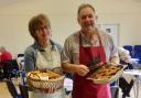 Pam Jarvie and Trefor Cook dishing up at previous Big Breakfast