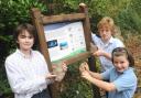 Time unravellers: Abberley Hall pupils with one of the fossils found on their school site and the information board. From left, Samuel Allen, 10, Tristan Lywood, 12 and Poppy Underwood, 9.