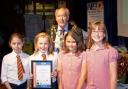 Mayor of Kidderminster, Cllr John Aston, with some of the junior Neighbourhood Watch Programme partcipants from Offmore Primary School receiving their certificates