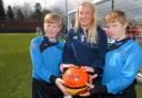 Back of the net: From left, Louie Middleton, 10, Chelsea Weston and Saulius Bartbevicius, 10, try out the new pitch at King Charles I School. Picture: Miriam Balfry. 111346M.