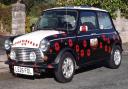 MOBILE MEMORIAL: Mike and Alan Winspur's poppy Mini will remember those who lost their lives in war.
