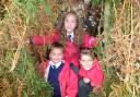 STONE AGE: Year three pupils Adam Holbrook, 7, Katie Healey, 7, and Izak Williams, 8.