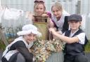 VICTORIANS: Burlish Park pupils Ellie Dusconi, Charlotte Roe, Harriet Ferris and Zachary Haywood, all aged 10, experiencing what life was like in the late 19th century.