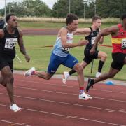 Toyko Paralympic bound Thomas Young, No. 116, straining in the 100m