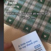 A still from the viral video that shows an NHS worker receiving a tea bag 