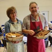 Pam Jarvie and Trefor Cook dishing up at previous Big Breakfast