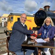 Gus Dunster, Severn Valley Railway's managing director, and Denise Wetton, Network Rail's Central route director, sign the partnership between the two railways