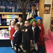 Terry Caffrey with year one pupils from the six SAET primary schools with many dressed as their favourite fictional character