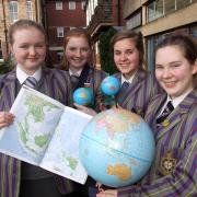 Globe trotters: From left, Holy Trinity International School students Katie Ludlam, 15 and Pippa Brazier, Sophie Bishop and Lauren Bennett, all 16.
