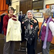 Viewing clothes: Fairtrade group members Vi Higgs, left and Mary Smith with a potential customer. Photos: COLIN HILL.