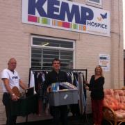 Stocking up: Kemp Hospice’s retail team get ready for the sale.