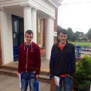 Friendly competition: Tommy and Will Cooper collect their grades.