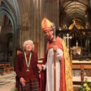 Service recognised: Diana Ingham with the Bishop of Worcester, Rt Rev John Inge and the Wulfstan Cross.