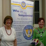 President Stephanie Ainsley (left) hands over to Incoming President Christine Holloway