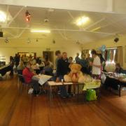 FUNDRAISERS: Visitors and stalls at the event in Clows Top Village Hall raising money for Vasculitis UK.