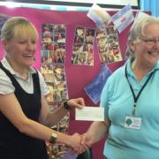 LENT LUNCH: Headteacher Tara Collins-Bullock receiving the cheque from Ruth Bird.