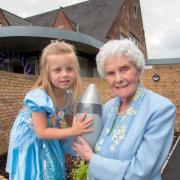 TIME DIFFERENCE: Four-year-old Phoebe Rose Harvey with 101-year-old Gwen Palmer with the time capsule that will be buried to mark the extension. 271414MH