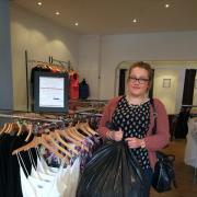 DONATIONS: Customer Melissa Price with her donated bag of clothes.