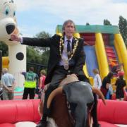 YEE HAA: Mayor of Kidderminster Mike Price taking a ride on the rodeo bull.