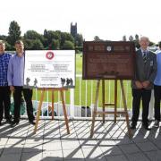 LOVINGLY RESTORED: Students and teachers from Stourport High School with the renovated and new memorial plaques.