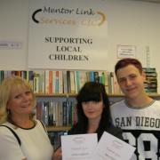 THANKS: Andrea Maddocks presenting two of the student volunteers, Alice Liggins and Ben Owen, with certificates.