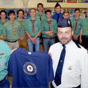 TWIN VISIT: Exchange of gifts between Silke Raap, leader of the Schobull Scouts, and Graham Knight, leader of 1st Kidderminster Boys’ Brigade. Picture: Colin Hill