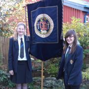 LOOKING BACK: King Charles pupils Chloe Taylor and Charlotte Lyon celebrating the school's annual Founders' Day.