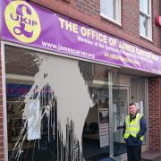 Wyre Forest UKIP group leader Councillor Michael Wrench outside the offices damaged in a vandalism attack