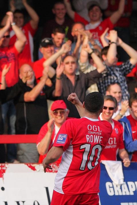 Ryan Rowe and the fans enjoy goal, which made the game safe for Harriers.