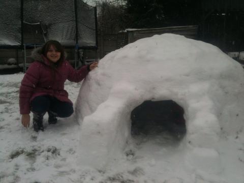 Cosy: St George's Primary School pupil Molly May Lambert built an igloo with her father. Picture: Dave Lambert.