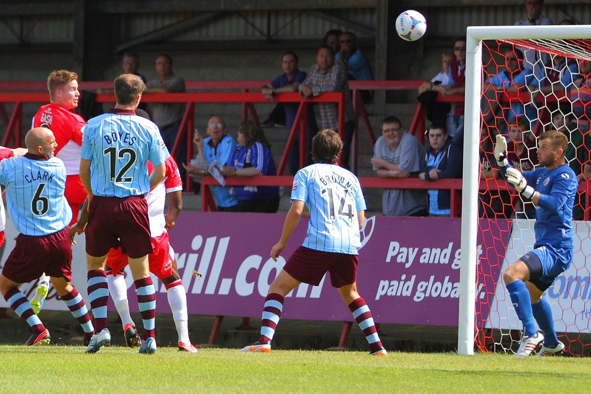 Michael Gash heads in Harriers' first goal.
