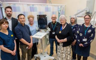 The donated ultrasound scanner surrounded by staff from the Urology Intervention Centre at the Alexandra Hospital and members of the League of Friends