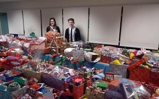 DONATION: Stourport High School pupils Eleanor Johnson, head girl, and Harry Bambury, head boy, with the collection of Christmas hampers.