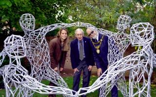 Art unveiled: From left, artist Lucy Unwin, chairman of Bewdley Festival Roger Key and Mayor of Bewdley John Latham with the commissioned piece. Photo: COLIN HILL.