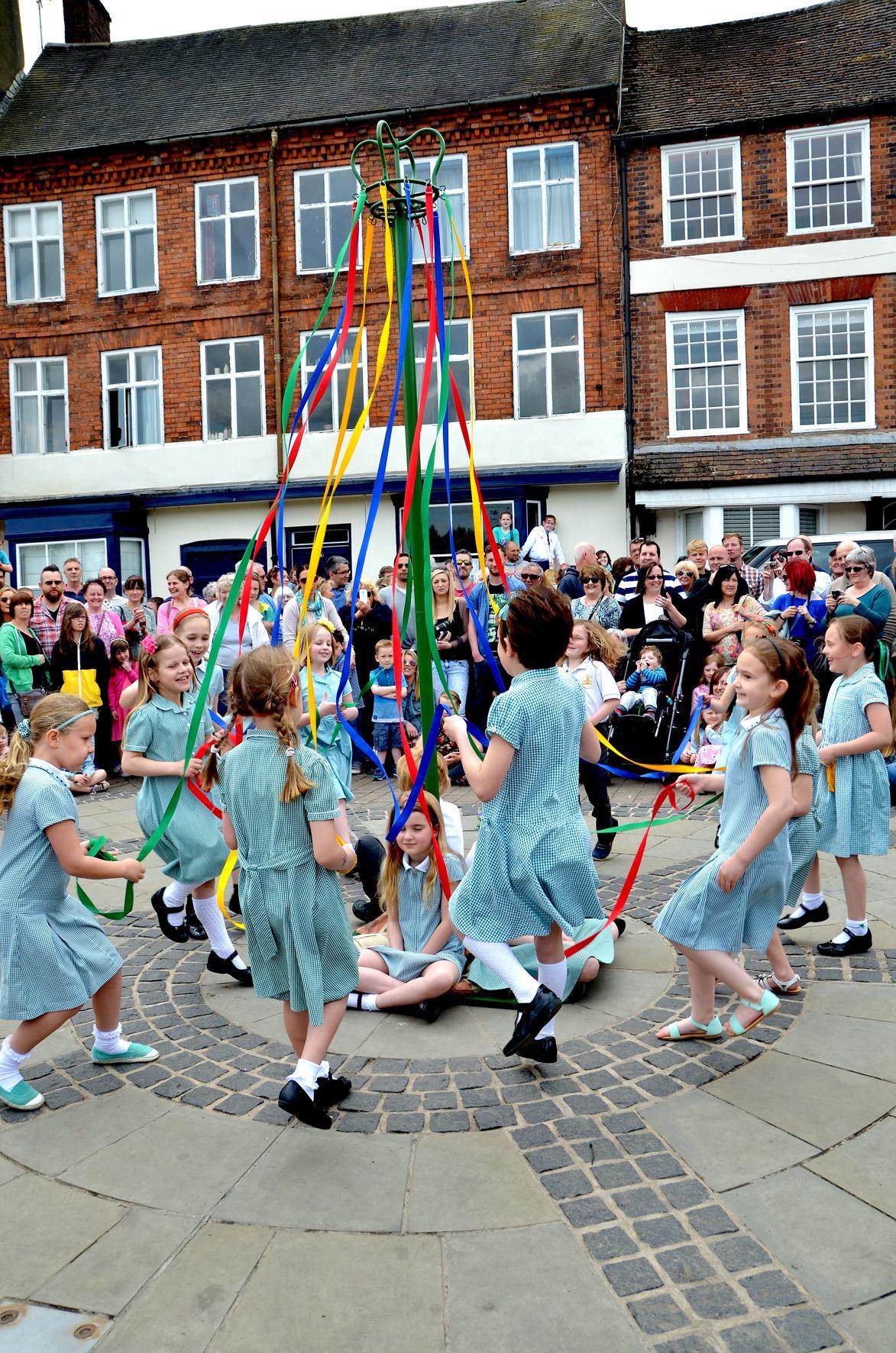 Maypole dancing with the children from St Anne's Primary School. PIC: Colin Hill