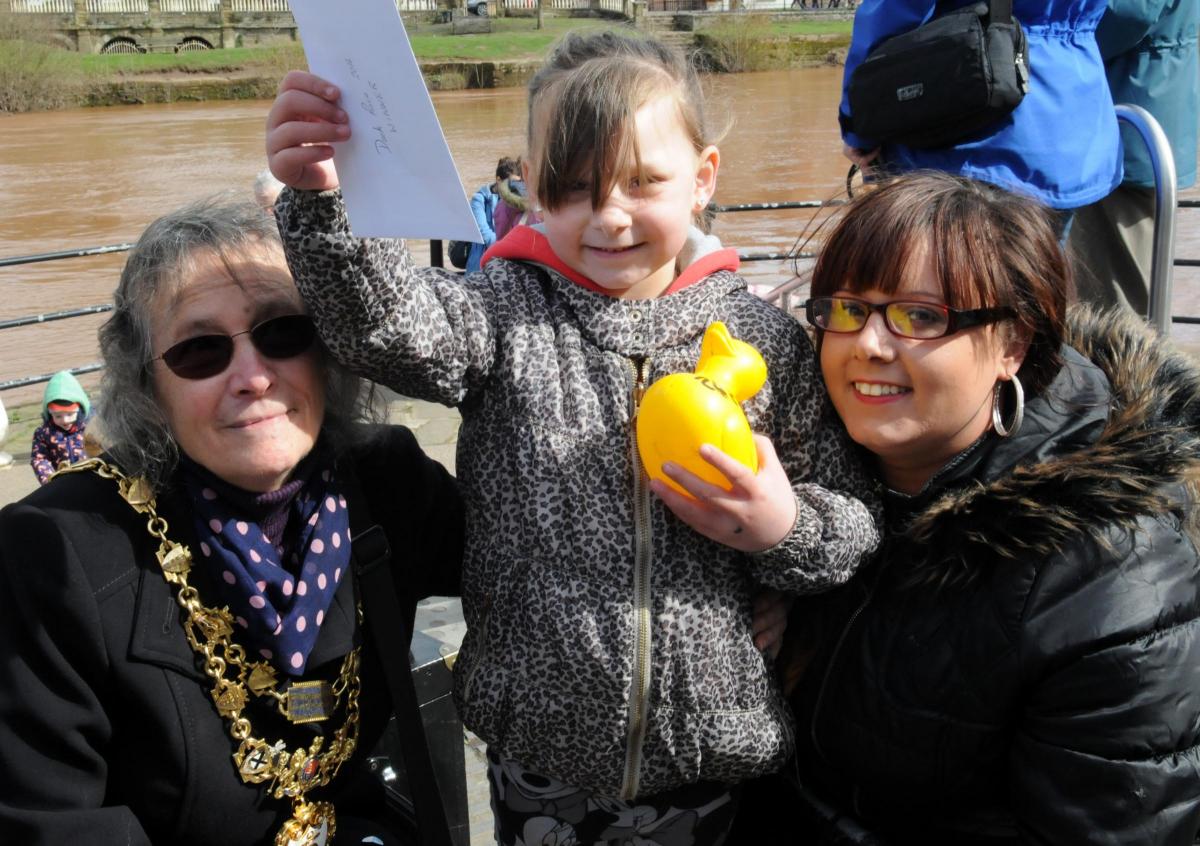 The Mayor of Bewdley, Calne Edginton-White, congratulates the winner of Bewdley Duck Race Ebony Bate, pictured with her mother Nicole Bate