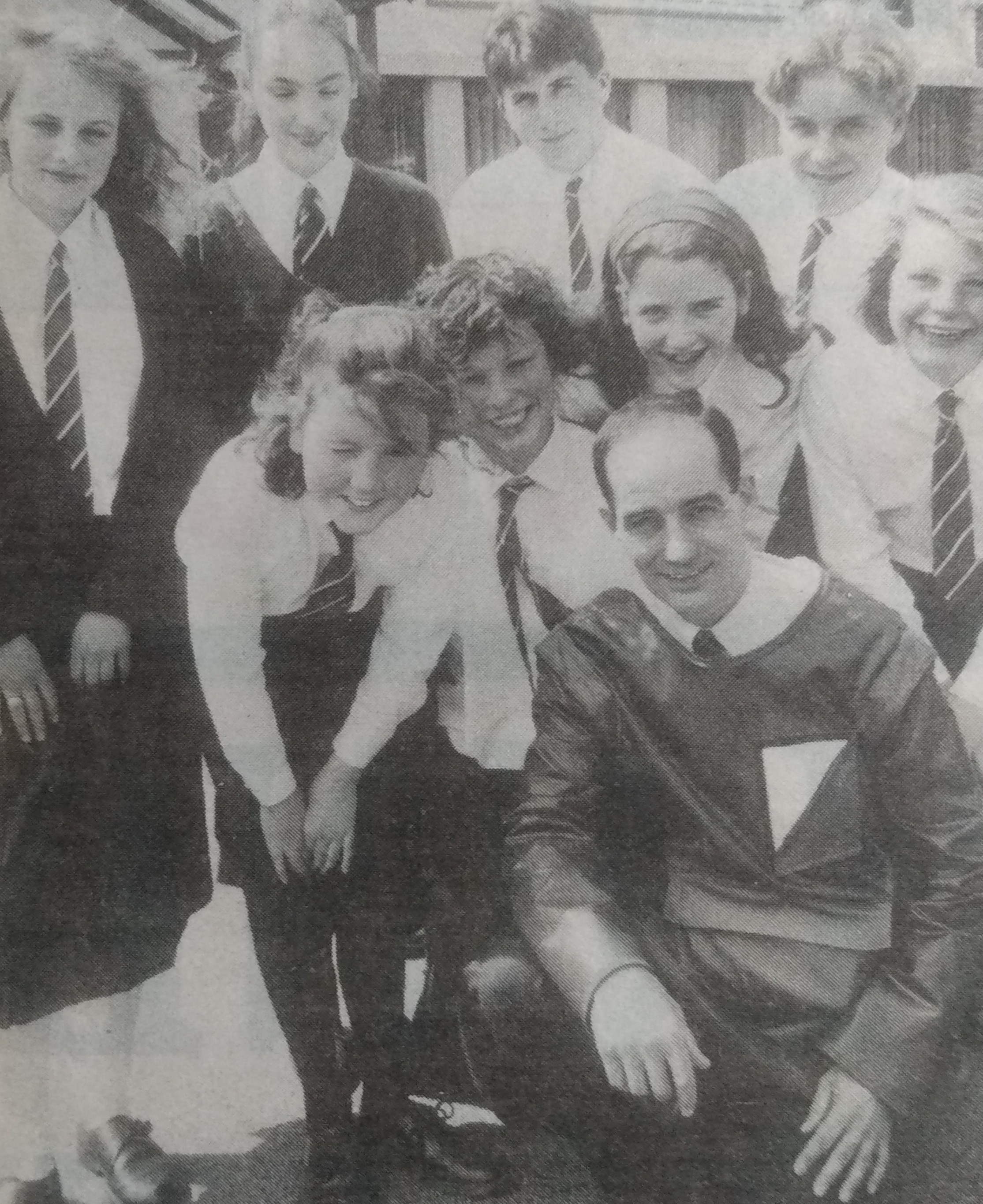 May 1992 and puils have teamed up with city-based Faithful Overalls to design a treated fabric jacket. The third year pupils are pictured with design manager David Etheridge