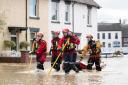 Search and rescue teams check on residents in Bewdley where floodwater from the River Severn has breached the town's flood defences following high rainfall from Storm Franklin. Photo: PA.