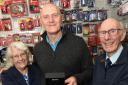 Melvyn Beard (centre) was presented with a watch for her service by his dad John Beard (right)
