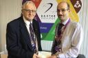 Kidderminster and District Lions Club president Ron Cross presents £900 to Baxter College DofE manager Andrew Macpherson