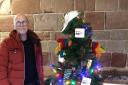 Gay Outdoor Club local organiser David Millar with the group's tree at the Worcester Cathedral Christmas Tree Festival