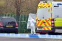 A forensic officer at the scene in Shetland Close, BD2, Bradford on April 18