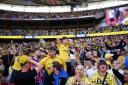 Oxford United supporters celebrate their side’s promotion to the Sky Bet Championship